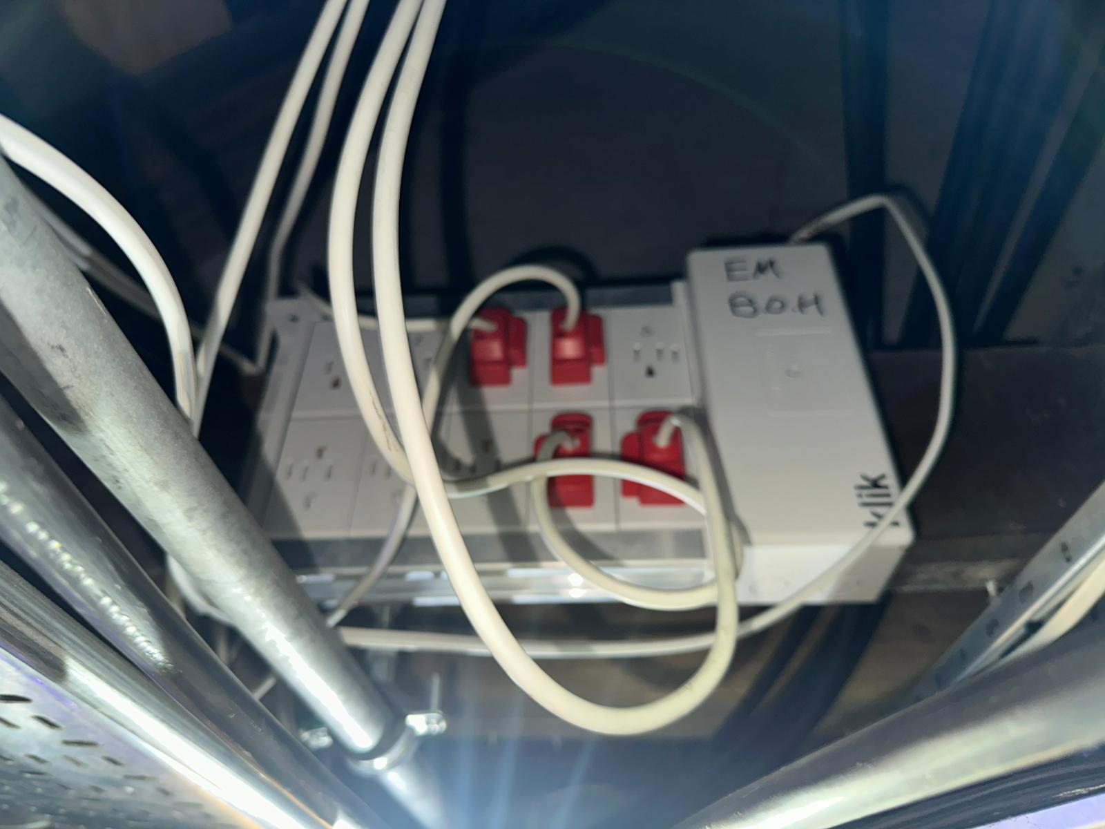 Overhead socket and connector block wired into a ceiling void