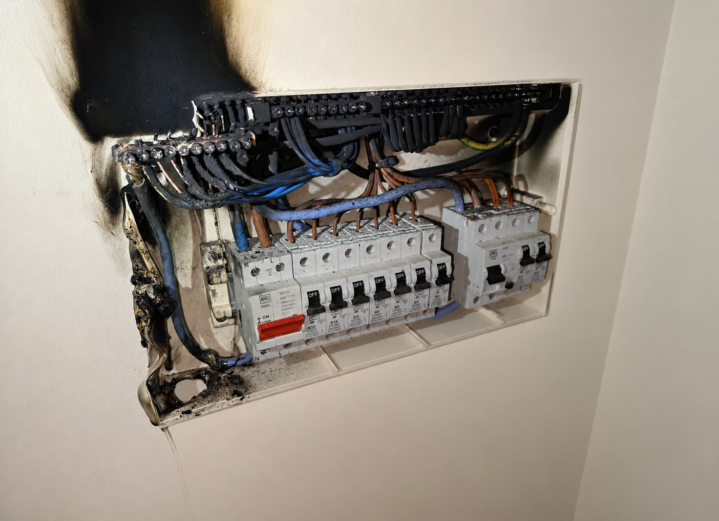 Fire-damaged fuseboard being made safe in Worthing